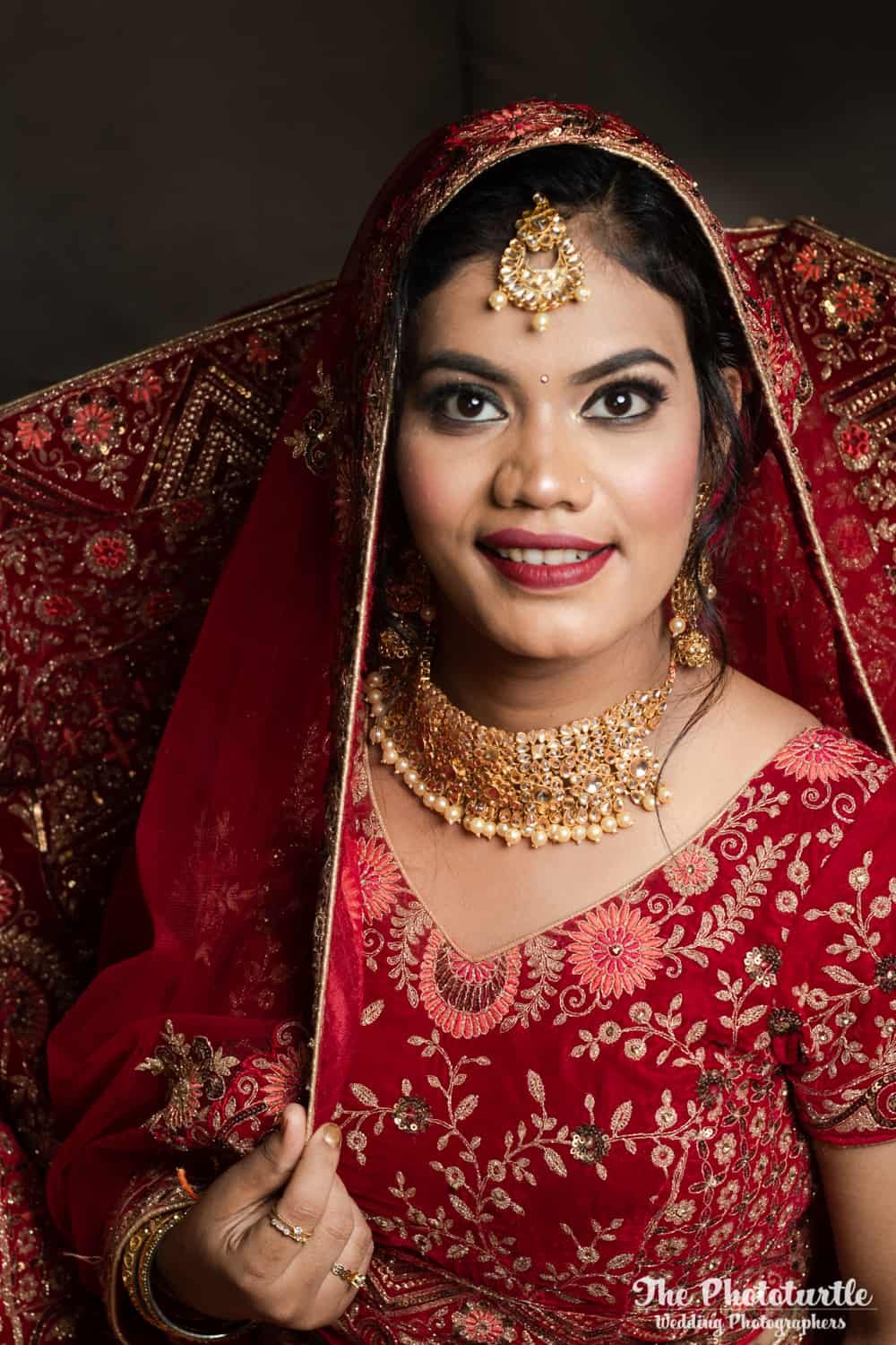 indian bride in a red lehenga portrait